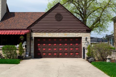 Two-car garage with a wooden garage door