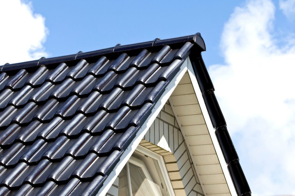 Metal, which is one of the best roofing materials, makes up shingles on a roof